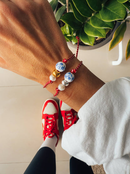 Spring bracelet with red cord porcelain bead and pearl: Yellow Gold