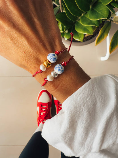 Spring bracelet with red cord porcelain bead and pearl: Yellow Gold